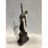 An Art Deco style spelter figure of a dancing girl in the manner of Lorenzl. On stepped plinth base.