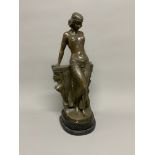 A large Art Deco style bronze of a seated lady on a two tier marble base. Signed Milo. 56cm(h)