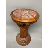A carved walnut marble topped jardiniere stand. W:40cm x D:40cm x H:61cm