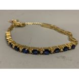 An 18ct bracelet with sapphires and diamonds.