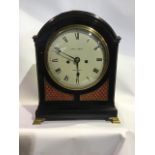 A Georgian ebony and gilt brass domed topped bracket clock. 8inch convex painted dial inscribed Edwd