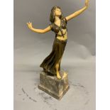 A gilt spelter and resin figure of a dancing lady in the manner of Lorenzl on marble plinth