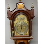 An early 20th Century mahogany Westminster chime long case clock, the arched hood with fluted