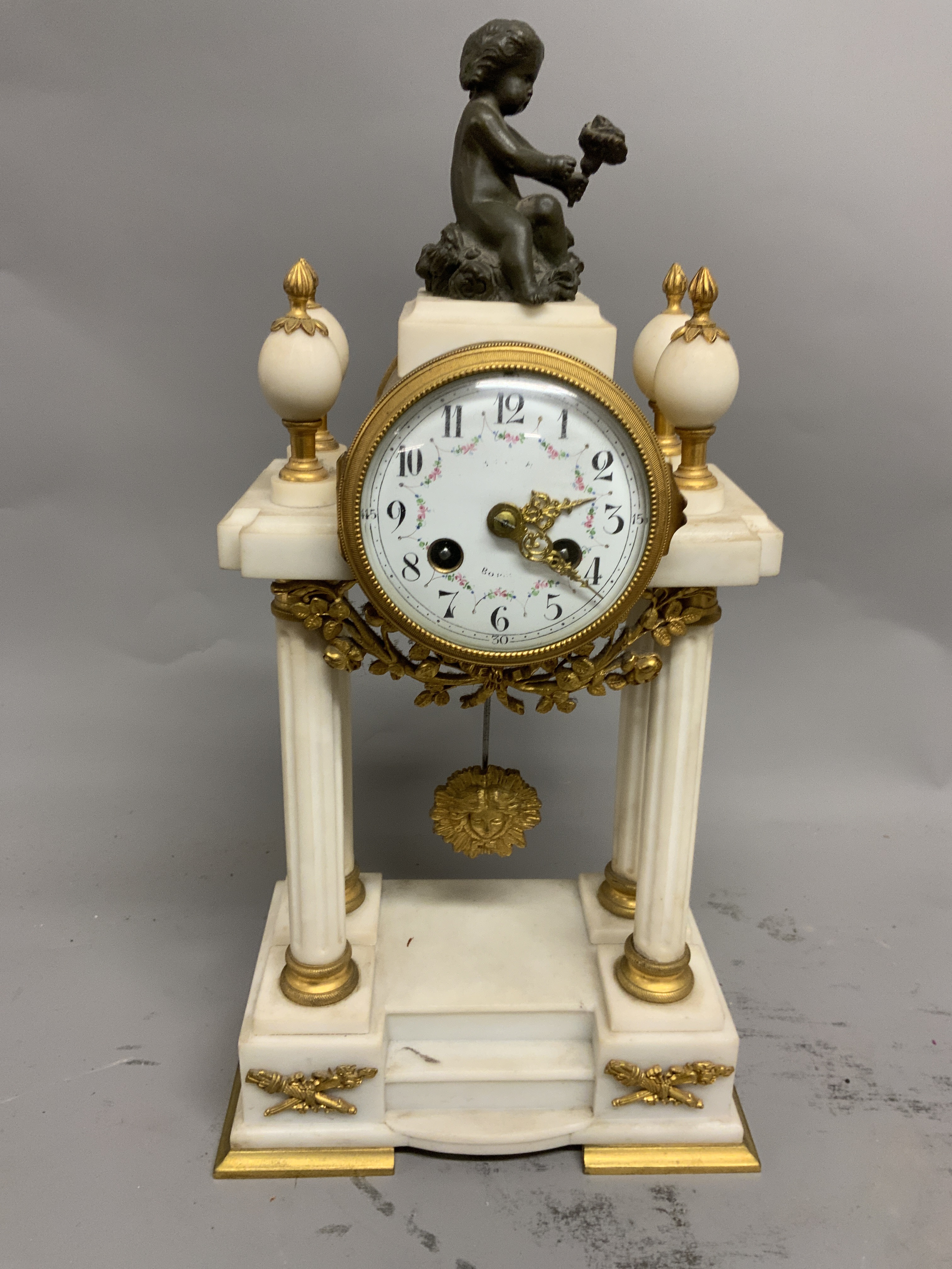 A French marble gilt metal pedestal mantle clock. Enamel face with Arabic markers and floral - Image 2 of 3