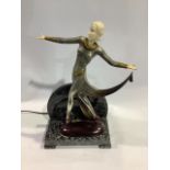 A patinated metal figural table lamp after a model by Josef Lorenzl, modelled as a dancer holding