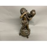 A large bronze figural group of two young children with foundry number stamp 222, 61cm(h)