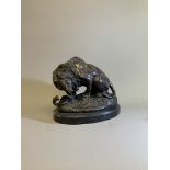 After Antoine-Louis Barye (French, 1796-1875).A bronze of lion and a snake on oval marble base.