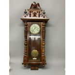 A large mahogany Vienna wall clock with weights and pendulum. 127cm(h)