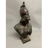 A bronzed bust of a classical gladiator on solce base. W:28cm x D:18cm x H:49cm
