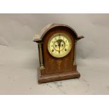 An American Ansonia mahogany cased mantel clock, with Arabic ivory coloured enamel chapter ring,
