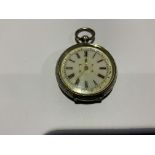 A French silver ladies key wind pocket watch with gilt enamel dial with Roman numeral markers.