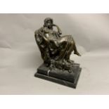 An early 20th century bronze sculpture of a reclining nude lady on stepped marble base. Signed