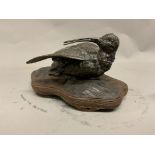 An oriental bronze model of a bird on carved hardwood base. Paper label verso. W:25cm x D:14cm x