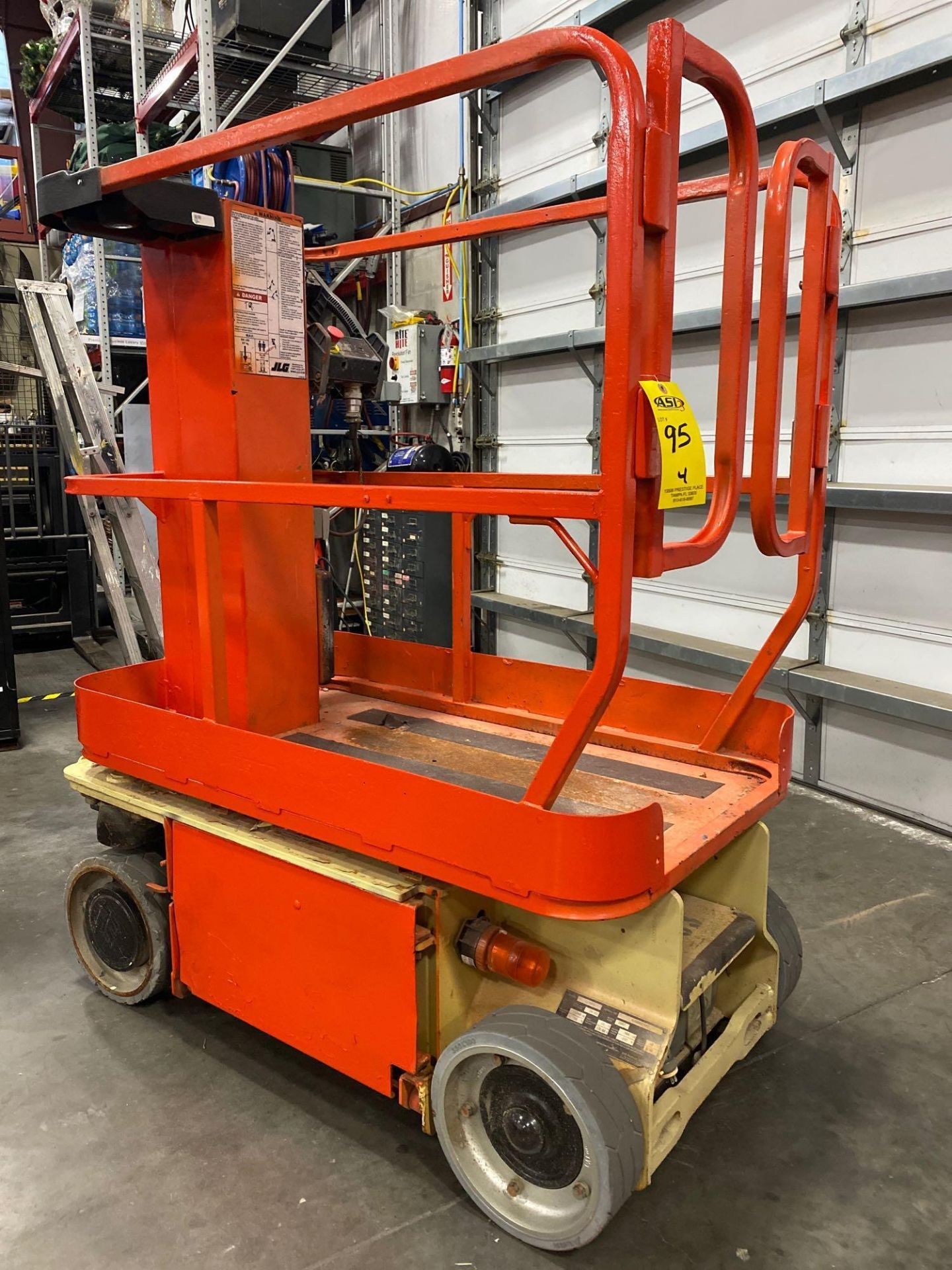 JLG 1230 ES ELECTRIC MAN LIFT, SELF PROPELLED, BUILT IN BATTERY CHARGER, 12' PLATFORM HEIGHT, APPROX