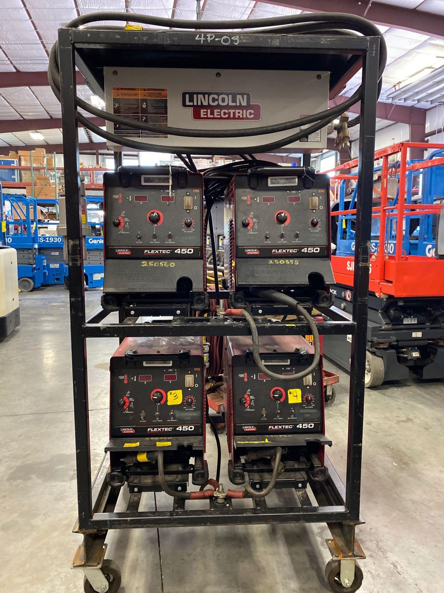 FOUR LINCOLN ELECTRIC FLEXTEC 450 WELDERS ON CART