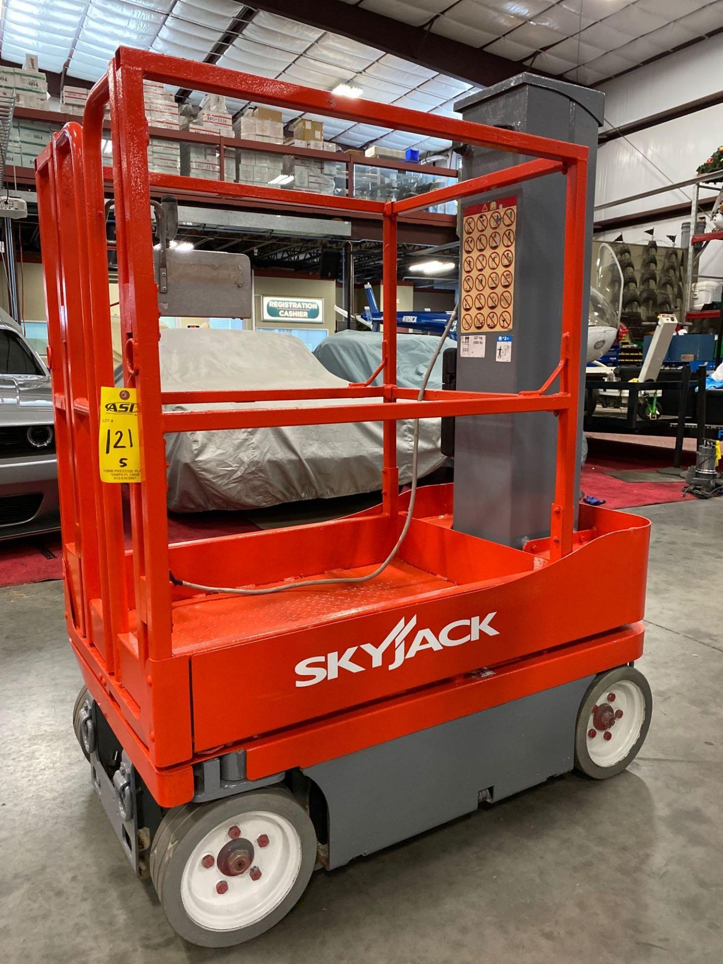 SKYJACK SJ12 ELECTRIC MAN LIFT, SELF PROPELLED, BUILT IN BATTERY CHARGER, 12' PLATFORM HEIGHT, 153 H