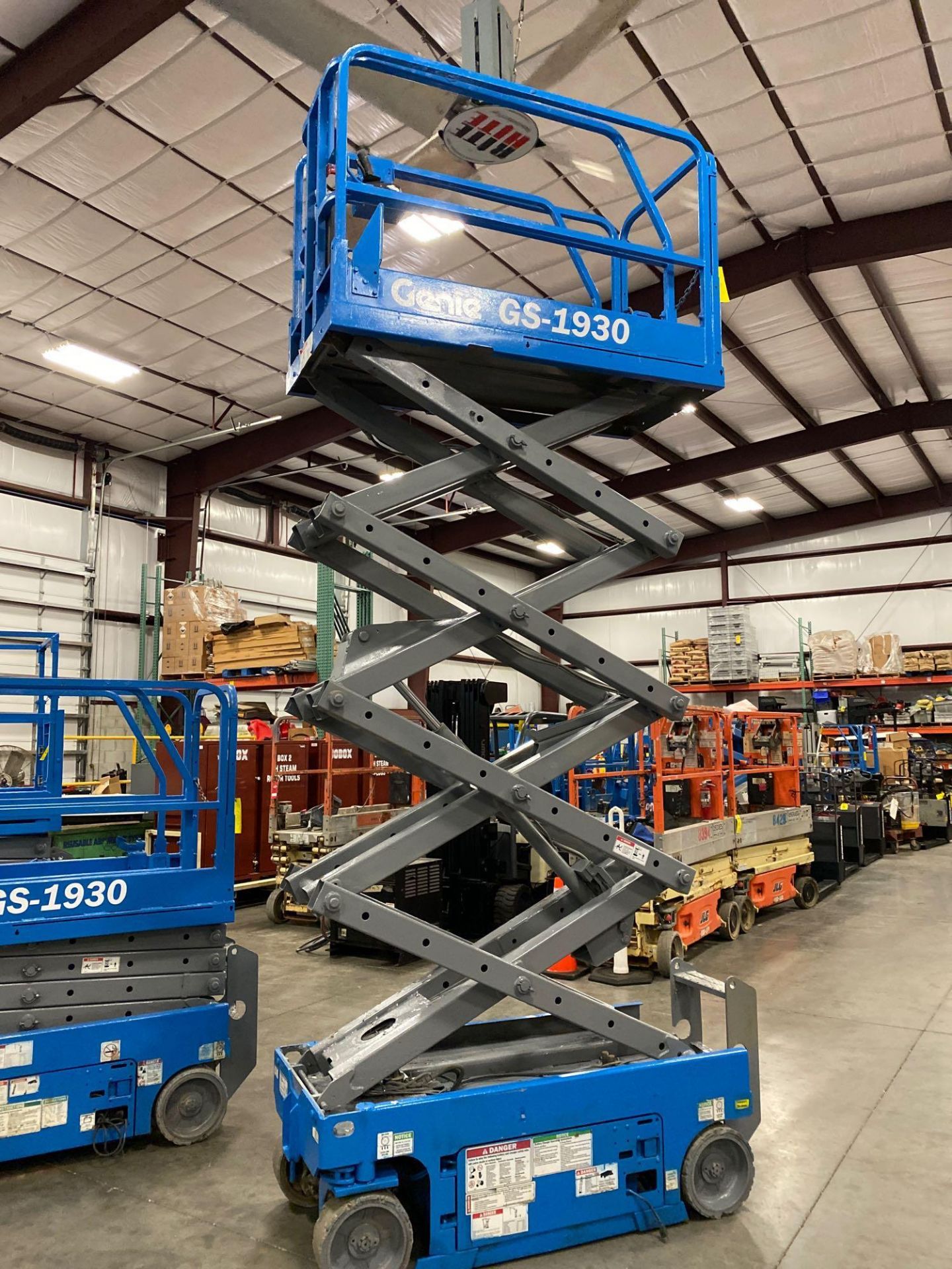 GENIE GS1930 SCISSOR LIFT, SELF PROPELLED, 19' PLATFORM HEIGHT, BUILT IN BATTERY CHARGER, SLIDE OUT