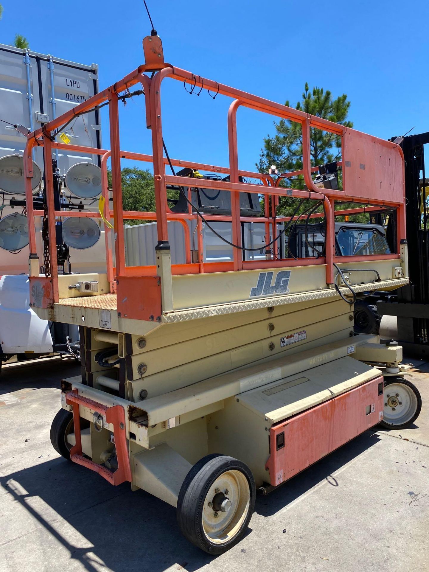 JLG 2658 ELECTRIC SCISSOR LIFT, SELF PROPELLED, SLIDE OUT EORK PLATFORM, BUILT IN BATTERY CHARGER, 2