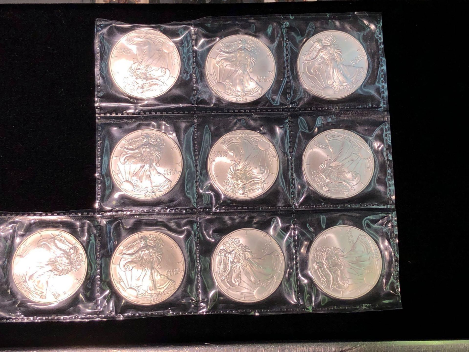 LOT OF 9 2004 AMERICAN EAGLE 1 OZT SILVER COINS SEALED IN PLASTIC