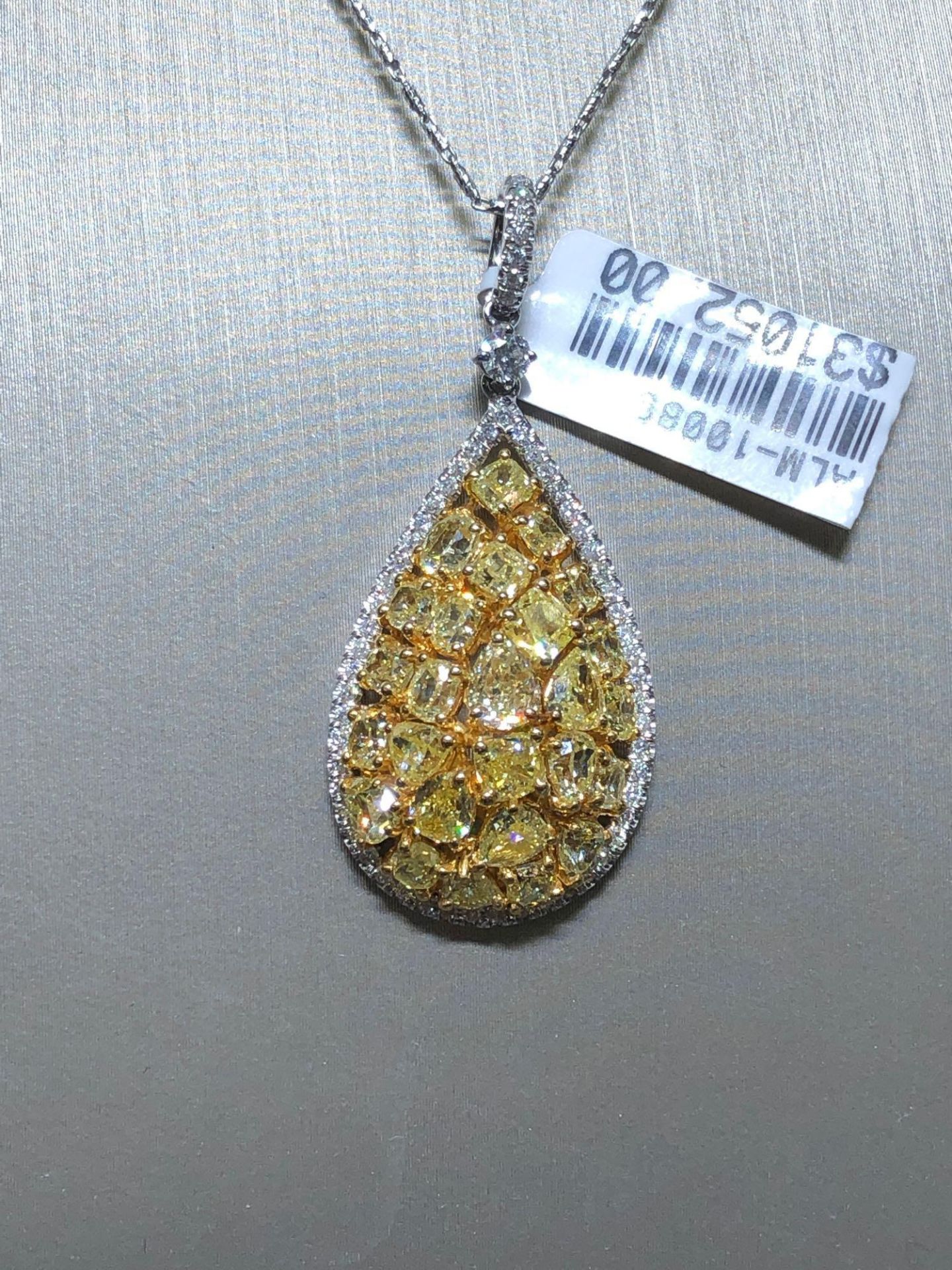 ONE OF A KIND YELLOW AND WHITE DIAMOND NECKLACE. 5.48CT FANCY YELLOW DIAMONDS AND .48CT WHITE DIAMON
