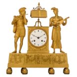 A fine ormolu mantle clock, decorated with musicians playing the lute and the flute, the music book