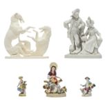 A collection of porcelain figures containing a Meissen porcelain figure of a gentleman with a cocker