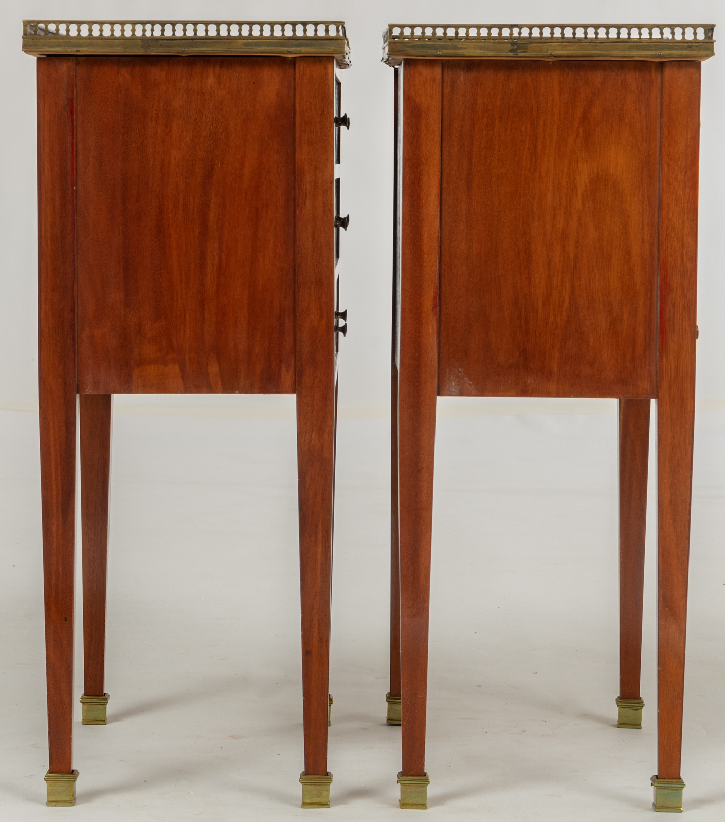 A pair of Neoclassical mahogany veneered side tables, with brass mounts and a gris Ste Anne marble t - Image 5 of 8