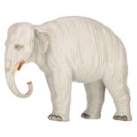 A Continental porcelain model of a white elephant, the features naturalistically picked out in colou