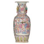 A Chinese floral decorated famille rose vase, the roundels with court scenes and figures in a landsc