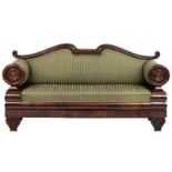 A mahogany veneered Biedermeier sofa, with circular armrests and lyre-shaped ending, the supports de