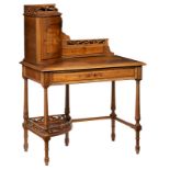 A Neoclassical walnut ladies writing desk, decorated with marquetery depicting a bird on flower a br