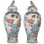 A pair of polychrome decorated Samson covered vases, depicting the pierced scholar rock in a garden