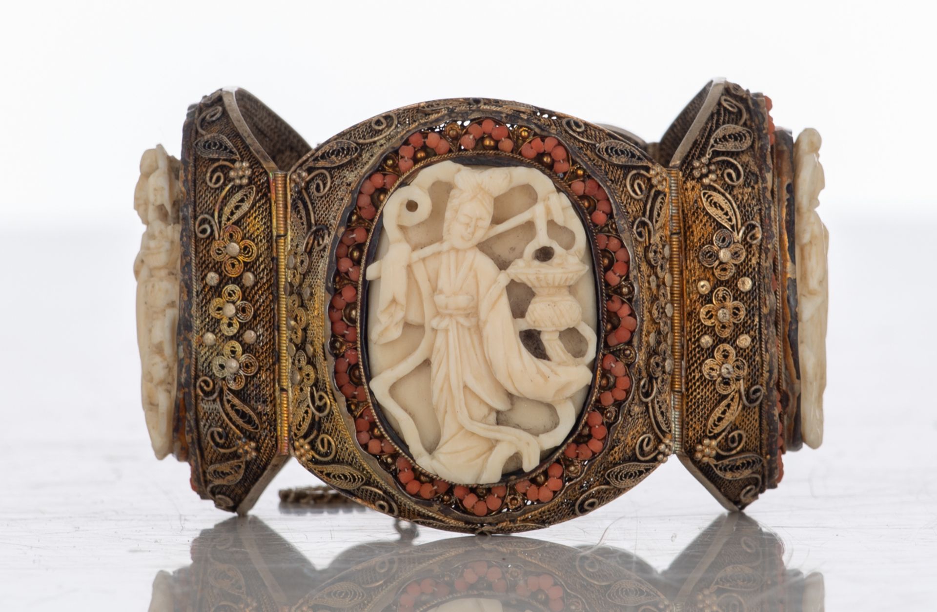 An Oriental filigree gilt silver bracelet set with basso-relievo cut ivory plaques surrounded by cor - Image 2 of 8