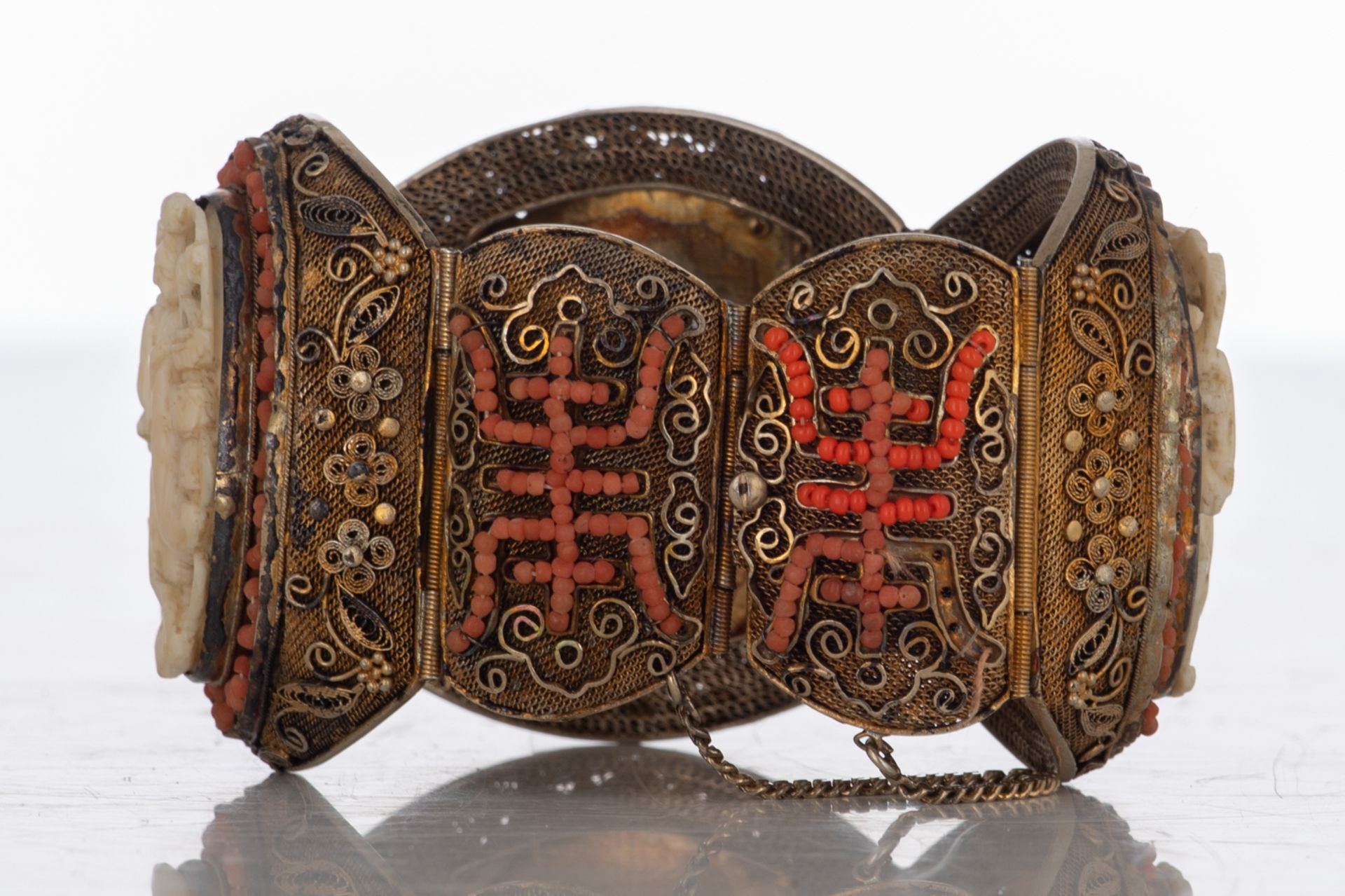 An Oriental filigree gilt silver bracelet set with basso-relievo cut ivory plaques surrounded by cor - Image 4 of 8