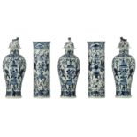 A Chinese blue and white five-piece garniture, decorated with boys carrying an antiquity, the covers