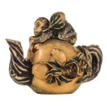 A Chinese antique polychrome ivory carved teapot and cover, decorated with fruit and a monkey, 1st h