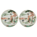 A pair of Chinese famille verte dishes, decorated with an animated garden scene, ø 23,5 cm