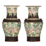 Two Chinese crackleware ground famille verte Nanking vases, all-over decorated with animated scenes