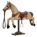 A wooden polychrome painted carousel horse mounted on a recent wooden stand, H (with stand) 138 cm /