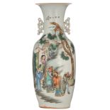 A Chinese polychrome vase, decorated with an animated scene with figures, the back with calligraphic