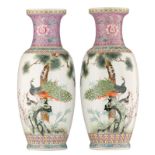 A pair of Chinese famille rose vases, decorated with peacocks on a rock, 2nd half 20thC, H 62 cm