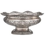 A large English silver openwork and relief decorated footed basket, marked 'Mappin & Webb'