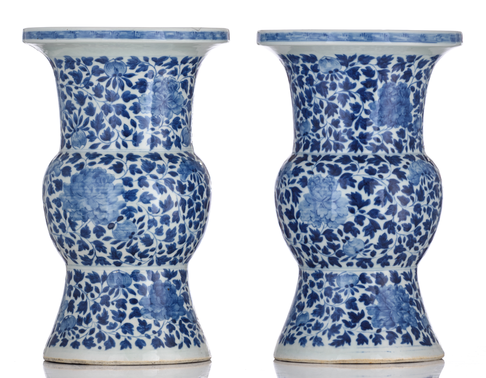 A pair of Chinese blue and white floral decorated Gu vases, 19thC, H 40,5 cm - Image 2 of 6