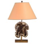 A brass design lamp with the cross-section of an agatized fossil coral, H 23 cm (the stone) 64,5 cm