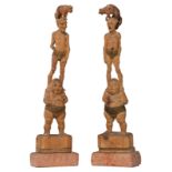 A pair of Japanese partly polychrome painted and  very characterful carved pine okimono depicting pe