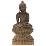 A probably Burmese seated wooden Buddha on a ditto double lotus base, H 49,5 cm