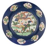 A Chinese famille verte and bleu poudré plate, the centre decorated with a phoenix and a dragon, H 5