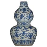 A Chinese blue and white double gourd vase, decorated with birds, H 49 cm