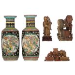 Three Chinese soapstone sculptures; added a pair of Chinese black ground and famille verte vases, 20