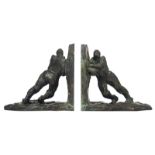 Demanet V., a pair of Art Deco bookends with pushing men, green patinated bronze, H 13 - W 14 cm